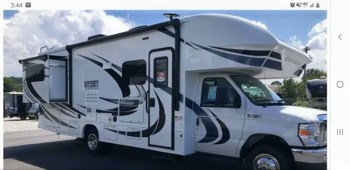 A white Class C Entegra Odyssey motorhome with an opened slide-out makes for a spacious RV rental. E450 chassis.. Entegra Coach Other 2021