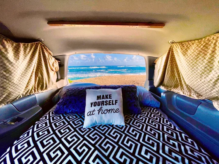 The rear balcony and awning provide pristine ocean views. Ford Van 1998