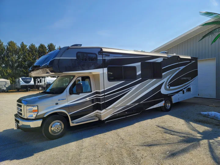 A modern silver and black Coachmen Leprechaun Class C RV on a Ford E-450 chassis, ready for your next rv rental.. Coachmen Leprechaun 2021