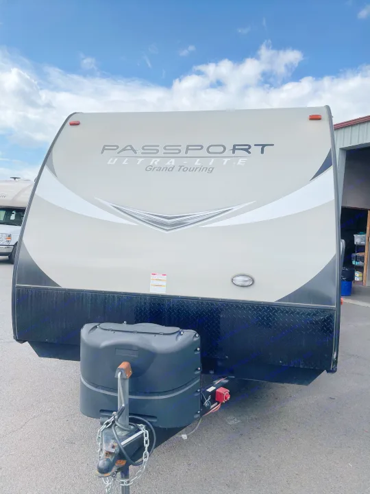 Front view of a Passport Ultra-Lite Grand Touring RV trailer, perfect for your next rv rental.. Keystone Passport 2400BHWE 2018