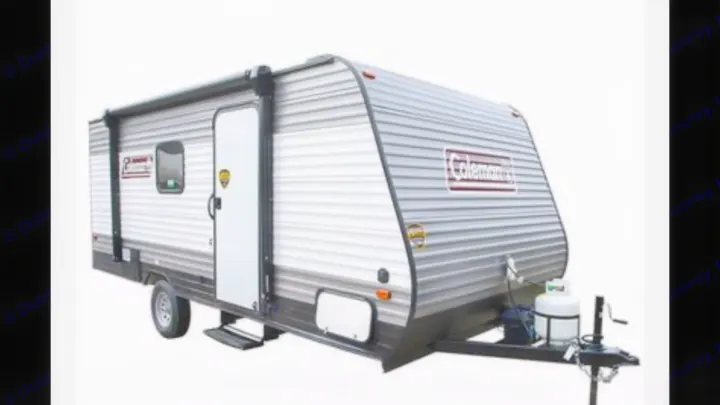 A grey Coleman travel trailer with a side door and awning, perfect for your next RV rental adventure.. Other Other 2021