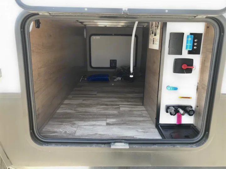 Through storage with centralized hookups. Grand Design Other 2021