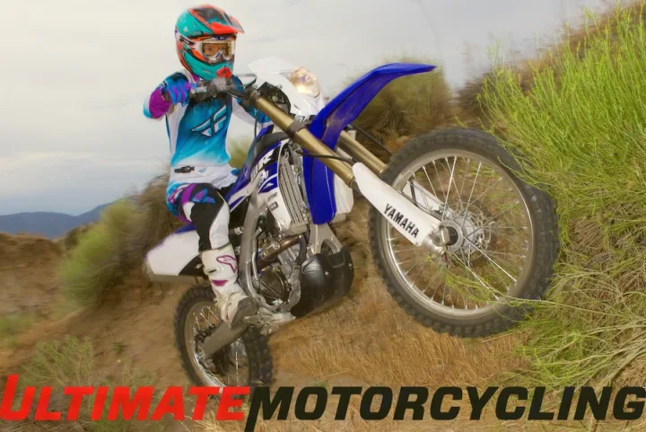 A motocross rider on a Yamaha dirt bike doing a wheelie uphill. An RV rental makes reaching these remote trails easy.. Yamaha WR250F 2015