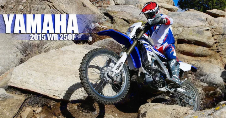 A rider on a blue Yamaha WR 250F dirt bike navigates rocky terrain. Explore similar off-road adventures with an RV rental.. Yamaha WR250F 2015