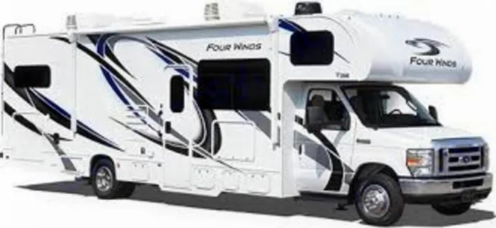 A white Class C RV with blue and black graphic decals along its side. This motorhome is shown parked, ready for rv rental.. Other Four Winds 2021