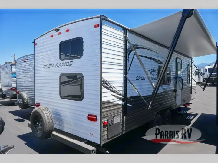 Spacious Open Range travel trailer RV with extended awning, ideal for your next rv rental getaway or camping trip.. Highland Ridge RV Open Range 2021