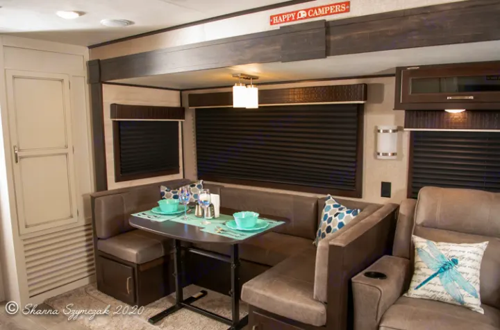 This RV rental interior features a cozy dinette set for dining, ample seating, and a warm, inviting atmosphere for your travels.. Jayco Jay Flight 2021