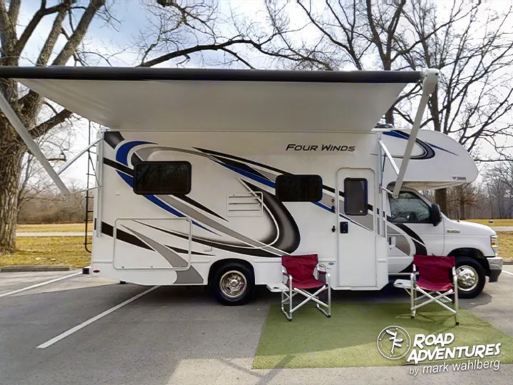 Passenger side with awning extended. Thor Motor Coach Four Winds 22E 2022