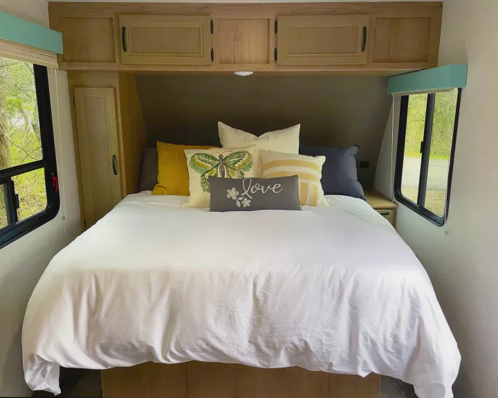 Comfortable Queen bed with memory foam mattress topper.. Winnebago Micro Minnie 2021