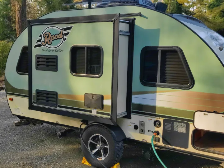 The slideout gives an extra 18" of room inside. This makes a world of difference!
Connections are easily made to your power and water sources.. Forest River R-Pod 2016