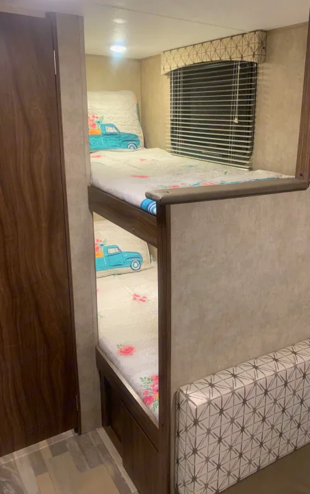 The head of each bunk is tucked away behind a wall providing a bit of privacy and quiet time if so desired.  Each bunk also has its own light.. Forest River Viking 2018