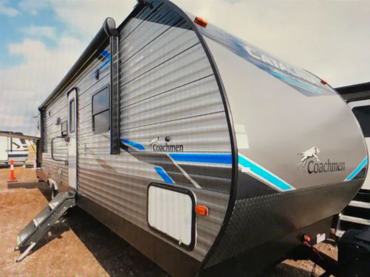 Grey Coachmen Catalina travel trailer for RV rental, with blue accents and extended steps.. Coachmen Catalina 2021