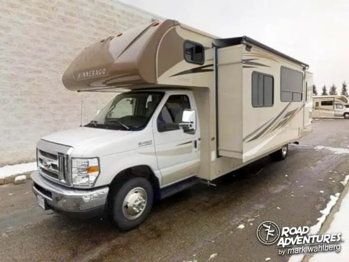 Front driver side with slide out extended. Winnebago Spirit 31K 2019