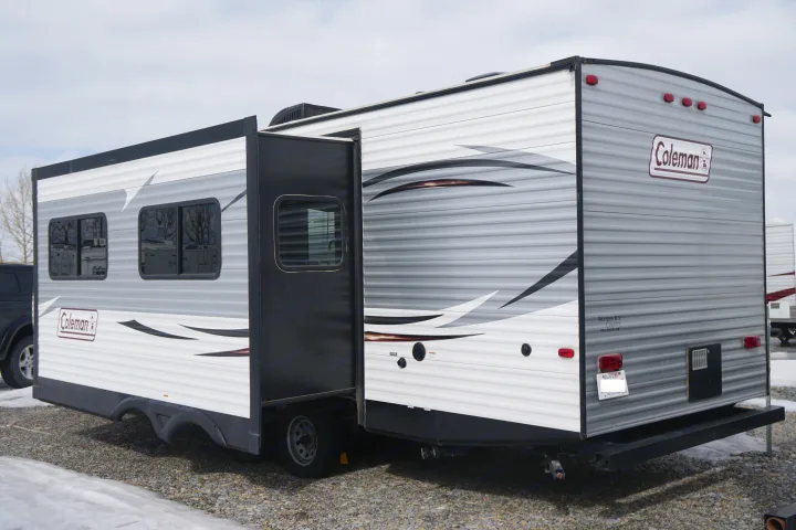 This spacious grey and white travel trailer with an extended slide-out is ready for your RV rental.. Coleman Lantern Edition 262 BH 2017