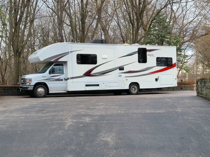 White Jayco Redhawk Class C RV rental parked on asphalt, ready for your next adventure.. Jayco Redhawk 2018