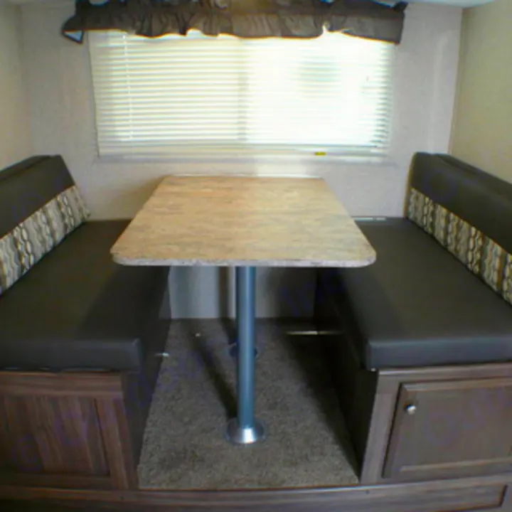 Explore this comfortable RV rental dinette: two bench seats face a table, perfect for meals or relaxation. Enjoy your RV travel.. Coachmen nano 2017