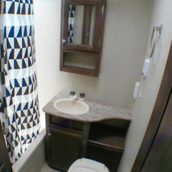 Explore this RV rental's compact bathroom, complete with a vanity, sink, mirror, and a shower featuring a patterned curtain.. Coachmen nano 2017