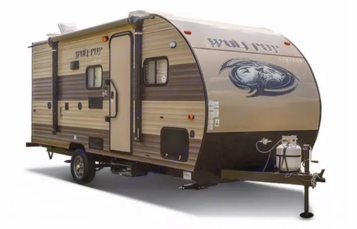 A sleek, compact brown and tan "Wolf Pup" travel trailer, ideal for your next RV rental and outdoor adventures.. Forest River Cherokee Wolf Pup 2017
