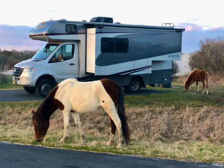 An RV rental parked, slide-out extended.. Winnebago Mercedes Sprinter 2020
