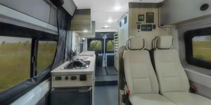 Automotive grade passenger seats with 3 point harness 
Kitchen with fridge a 2 burner cooktop. Winnebago SOLIS 59 PX Winnebago Camper 2021