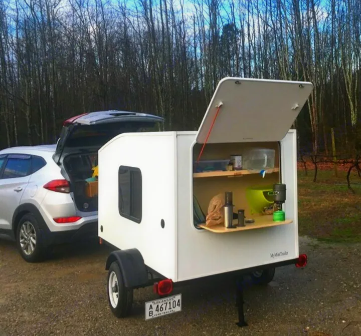 A perfect fold down counter space with electric hookup and storage.. Custom Teardrop Camper 2018