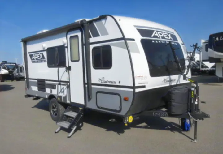 This white and gray Coachmen Apex travel trailer is ready for your next RV rental adventure.. Coachmen Apex 2021