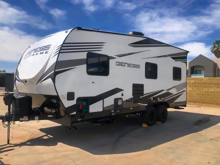 Spacious white & gray Genesis Supreme RV travel trailer/toy hauler for rv rental.. Genesis Supreme Rv Genesis Supreme 2021