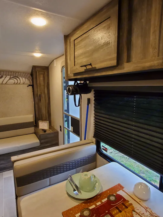 Experience comfort in this rv rental. Bright interior features a dinette, overhead cabinets, projector, and window with blinds.. Forest River Salem 2020
