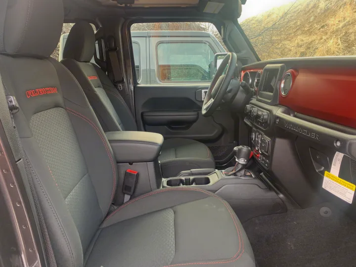 Spacious black Jeep Wrangler Rubicon interior with red accents & stitching. Ready for any RV rental adventure.. Jeep Gladiator Unlimited 2020