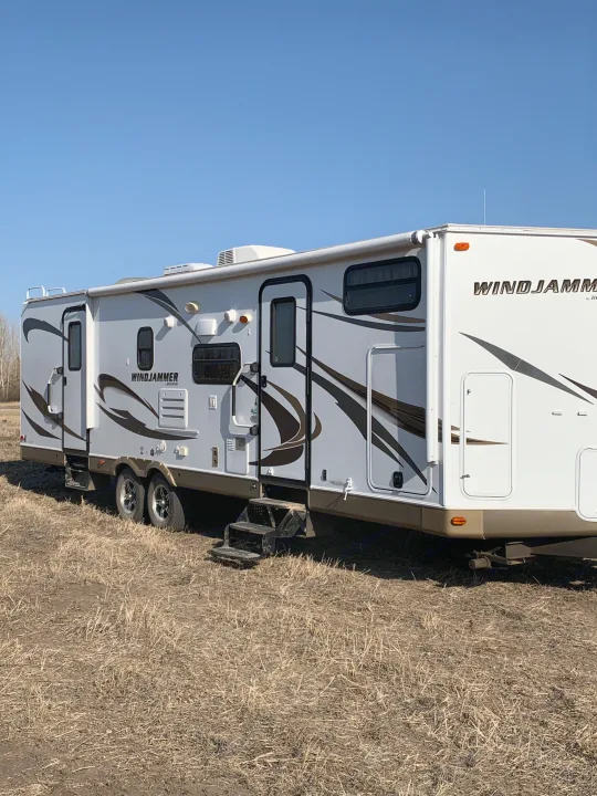 Two entry doors, one to master and one to kitchen and living room. 
Power awning and power. Forest River Rockwood Windjammer 2013