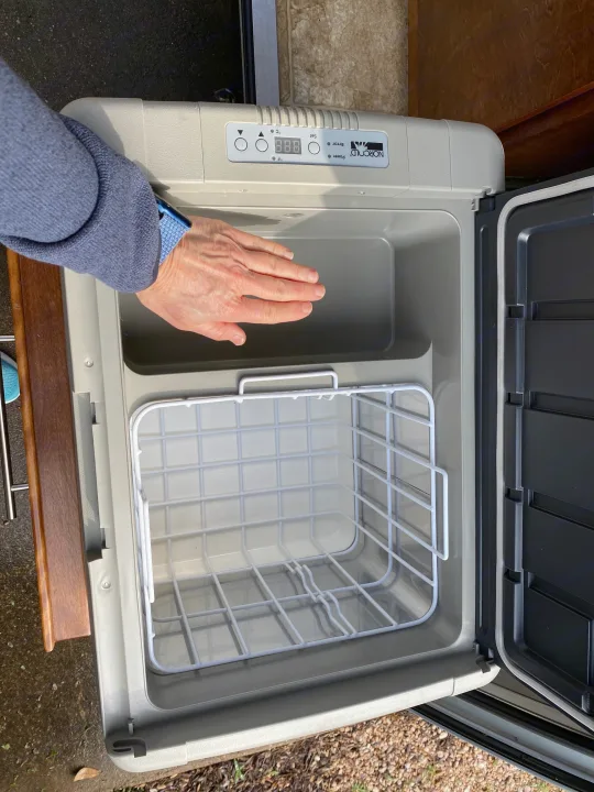 Inside a spacious Norcold portable fridge-freezer, ready for your next RV rental trip.. Little Guy NuCamp 2015