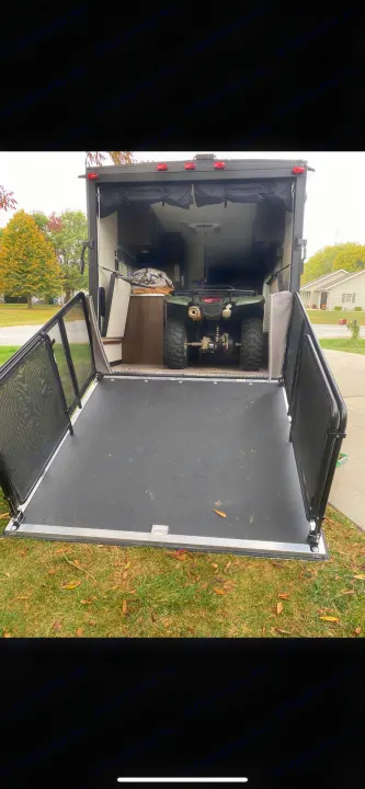 This toy hauler RV rental offers a spacious interior, ramp patio, and convenient ATV storage for outdoor adventures.. Forest River Wolf Pup 2021