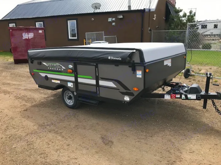 A grey Rockwood Freedom pop-up camper rv rental, compact and ready for your next outdoor camping adventure.. Forest River 1940 LTD 2020