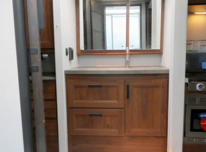 RV rental: Compact vanity with sink & mirror, adjacent to kitchen with stove and microwave.. Forest River Other 2021