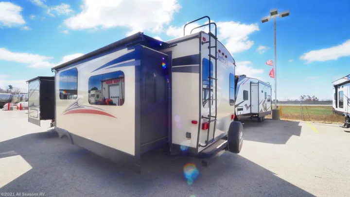 Large travel trailer with slide-outs extended, ideal for rv rental, parked on an outdoor lot. Perfect for adventures.. Keystone Outback 2016