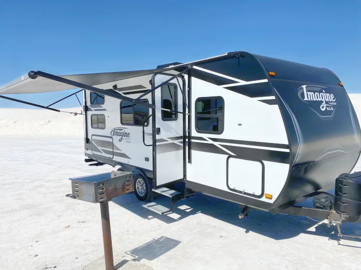 Check out the amazing awning that covers most of the front of the camper.. Grand Design Imagine XLS 21BHE 2020