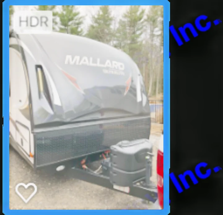 Front view of a grey Mallard travel trailer RV, featuring its hitch and ready for your next RV rental adventure or camping trip.. Heartland M29 2017