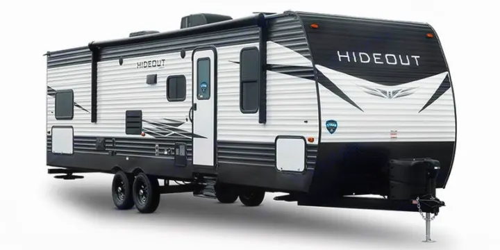 A sleek white and black Hideout travel trailer, perfect for your next RV rental adventure. Ready for the open road!. Keystone Hideout 2021