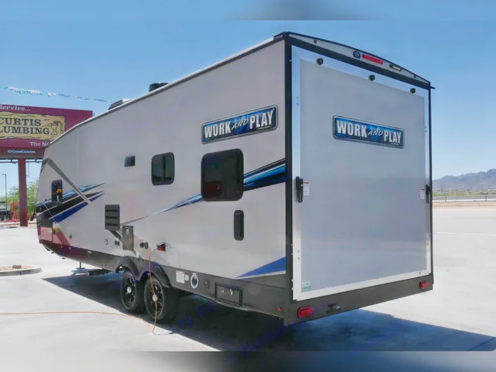 Modern grey Work and Play toy hauler RV available for rv rental. Its large rear ramp is ready for your gear & outdoor adventures.. Forest River Work And Play 2021