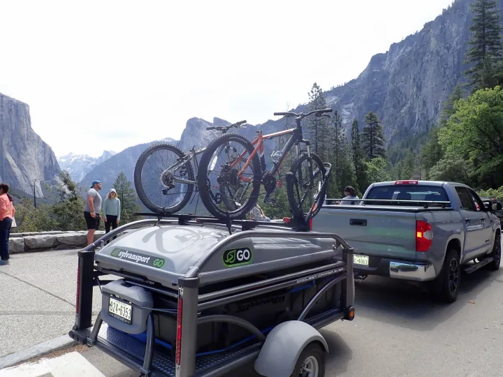 SylvanSport GO camper (an RV rental option) with bikes, towed by a Tundra in majestic mountains. Adventure awaits!. Other Other 2018