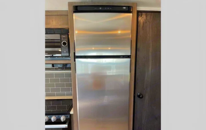 This RV rental features a modern stainless steel fridge, microwave, and stove for a complete kitchen experience.. Other Hideout 2021