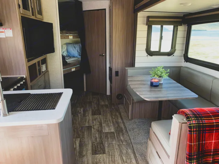 Step inside this modern RV rental! Features a well-equipped kitchen, dinette with views, and bunk bed sleeping.. Crossroads RV Sunset Trail Super Lite 2021