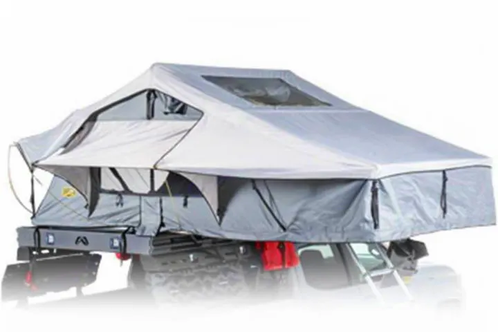 Spacious grey rooftop tent mounted on a tracked off-road vehicle, perfect for rv rental camping adventures.. Smittybilt Overlander XL Gen 2 RTT 2021