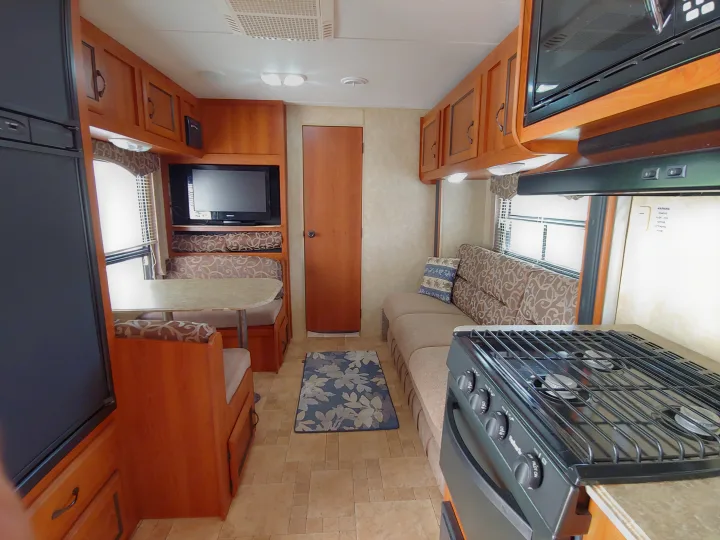 Experience a cozy RV rental: features kitchen, dinette, and living area with sofa and ample storage.. Coachmen Catalina 2011