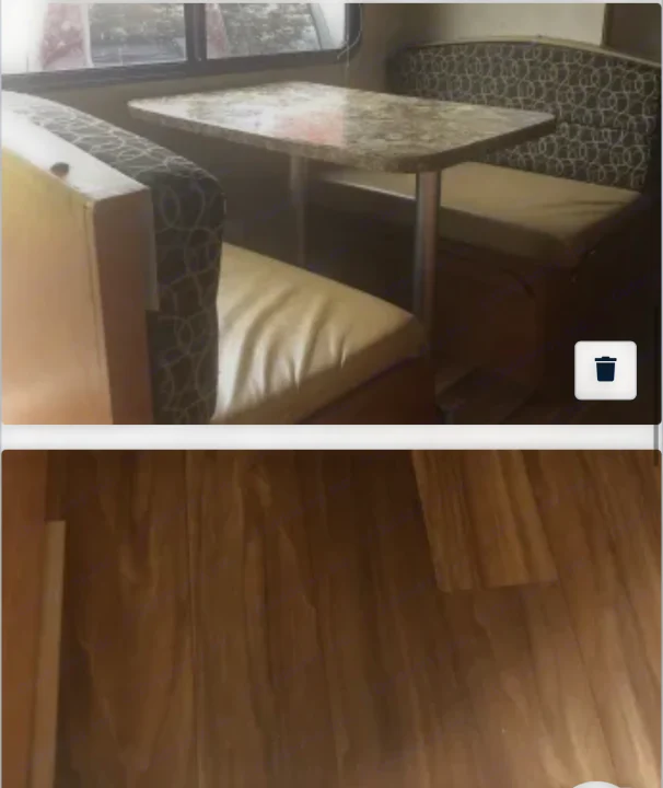Explore this RV rental's cozy dinette area with patterned seating, granite table, and wood floor.. Gulf Stream Amerilite 2014