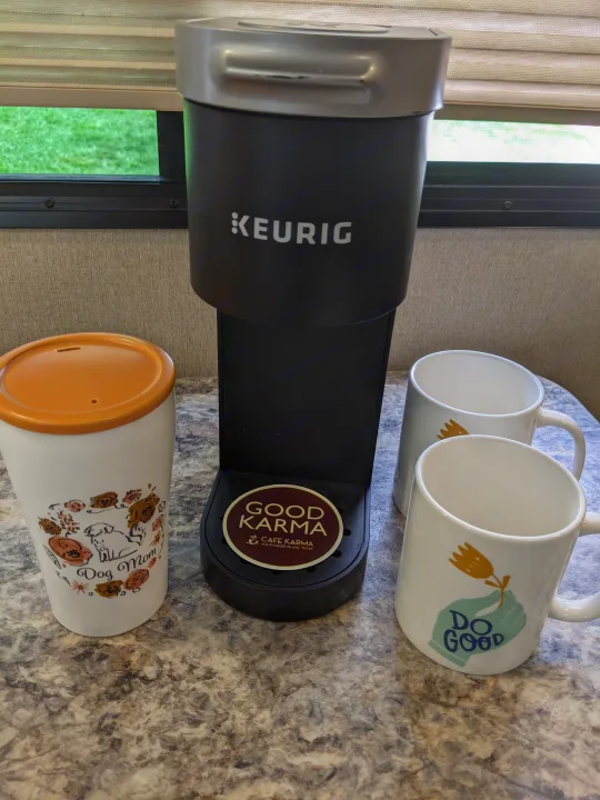 RV rental coffee station: Keurig machine, 'Good Karma' coaster, 'Dog Mom' mug, & 'Do Good' mugs on counter.. Other Other 2017