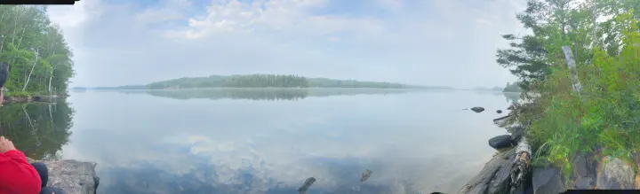 Experience nature's calm with an RV rental: panoramic lake view, misty forests, and mirrored sky.. Dutchmen Kodiak 2019