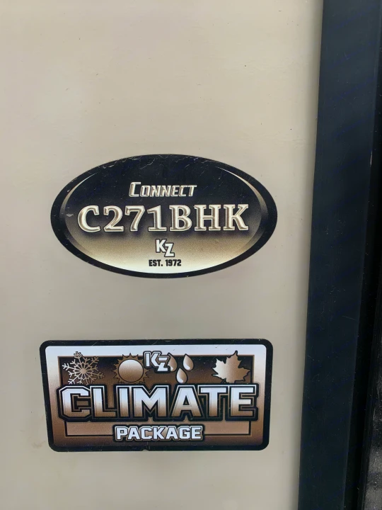 This RV rental showcases its Connect C271BHK model and KZ Climate Package through prominent decals on its white exterior.. K-Z Manufacturing Connect 2018