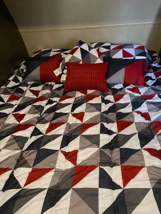 This room has walk around queen sized bed with upgraded memory foam. There is a reading light and plenty of storage on each side of the bed. . Forest River Wildwood X-Lite 2018
