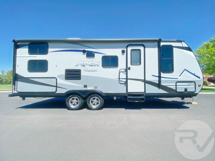 Side view of a modern gray Apex Ultra Lite Coachmen travel trailer RV, ready for your next RV rental adventure.. Coachmen Apex 2021